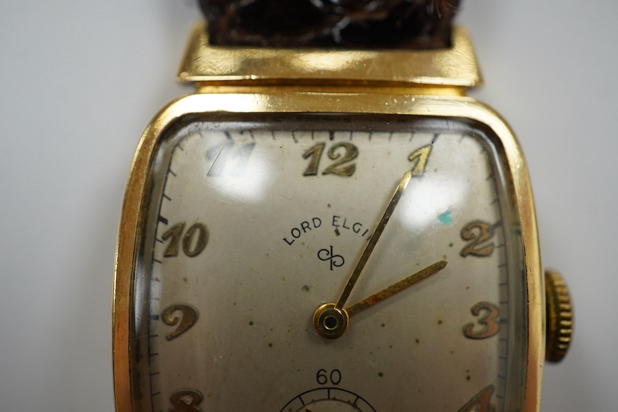 A gentleman's 14k Lord Elgin manual wind wrist watch, with Arabic dial and subsidiary seconds, case diameter 25mm, on an associated leather strap. Condition - poor